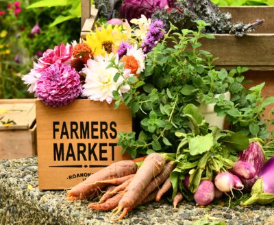 Home grown vegetables and colorful flowers for sale at Farmer's Market