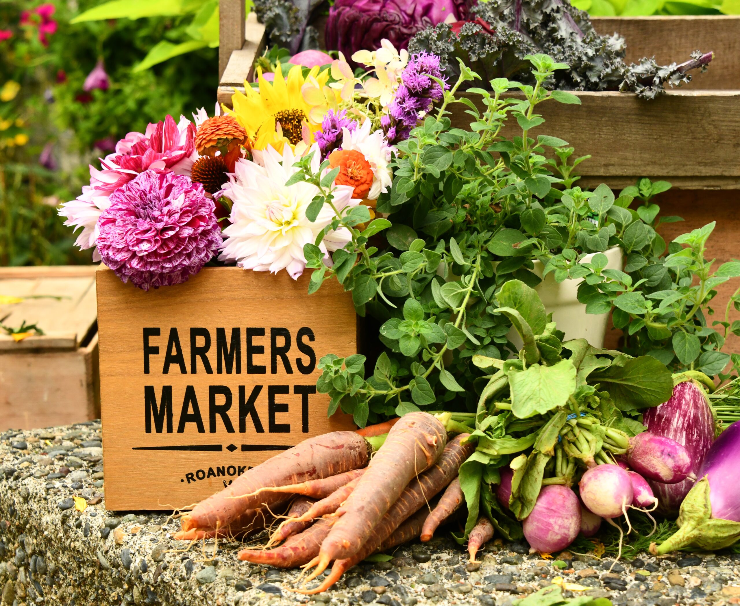 Home grown vegetables and colorful flowers for sale at Farmer's Market